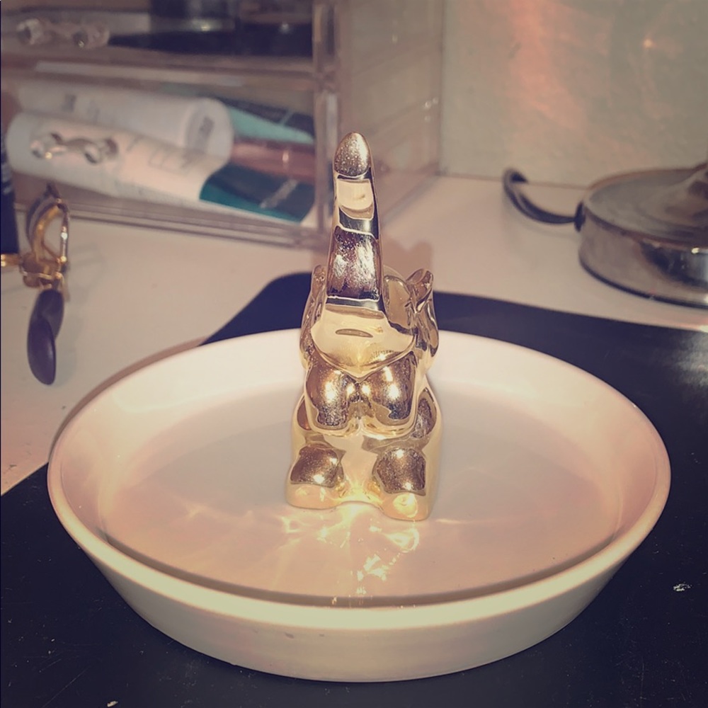 gold and white elephant jewelry plate